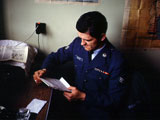 Dennis Daniels reading a letter 
