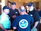 Jake Beisel, John Ging and Steve Bisel talk with Bill Woodward (back to the camera)