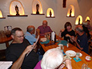 The group sits down for dinner in the Santos Room