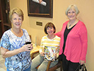 The ladies prepare to inspect the debriefing room. Jeanne Schabel, Dede Carr and Linda Ging