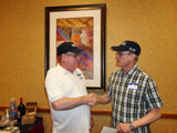 Steve Carr presents the pin to Bob Mosley