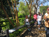 Pauline Bisel tries out the joggling board at the Nathaniel Russel house.