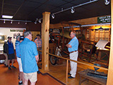 Talking with a volunteer at the museum