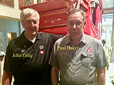 John Ging and Paul Baker pose in front of the Wells Fargo stagecoach replica