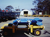 Out in bomb dump AGE lot. Note Delta ID’s on the trucks. MHU-12 with inert M117’s