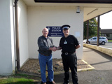 Photo of Gary Stull and guide at the base police station. Submitted by Gary Stull